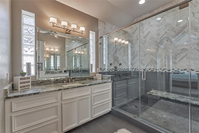 13625 Lakeside Place Dr, Willis, TX 77318 - full bath with tile patterned flooring, ceiling fan, a shower stall, and vanity