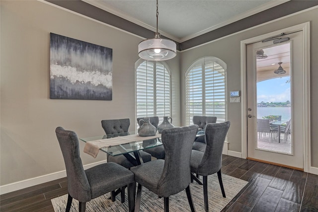 13625 Lakeside Place Dr, Willis, TX 77318 - dining space with baseboards, a water view, crown molding, and wood finished floors