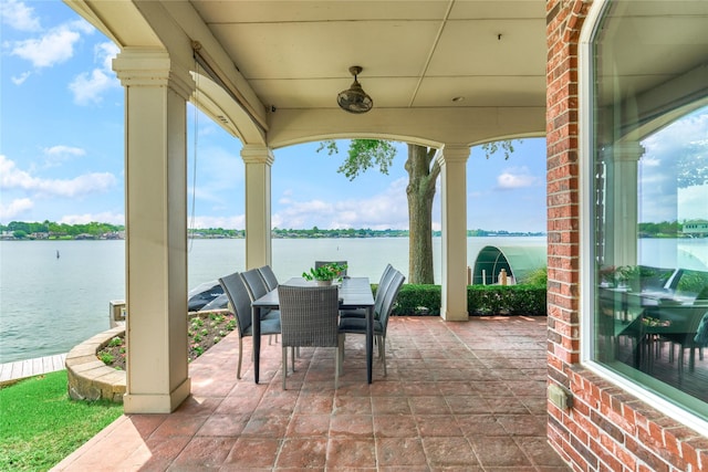 13625 Lakeside Place Dr, Willis, TX 77318 - view of patio with a water view and outdoor dining space