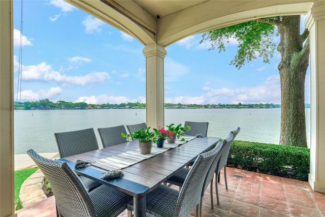 13625 Lakeside Place Dr, Willis, TX 77318 - view of patio featuring a water view and outdoor dining space