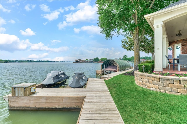 13625 Lakeside Place Dr, Willis, TX 77318 - dock area featuring boat lift, a yard, and a water view