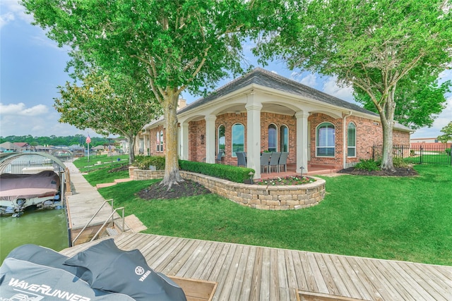 13625 Lakeside Place Dr, Willis, TX 77318 - dock area with boat lift, fence, and a lawn