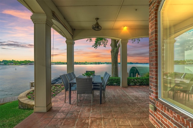 13625 Lakeside Place Dr, Willis, TX 77318 - view of patio with a water view