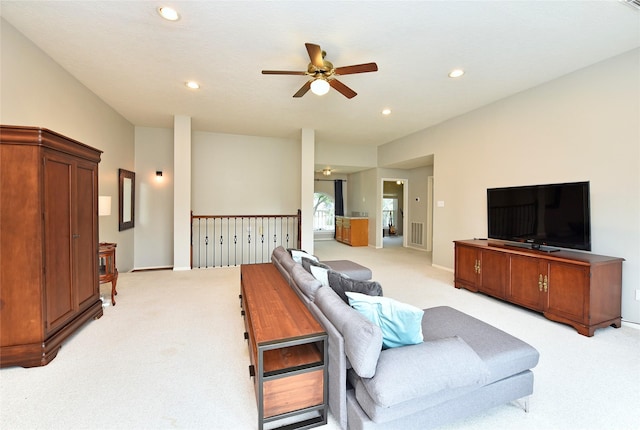 living room featuring recessed lighting, ceiling fan, light colored carpet, and visible vents