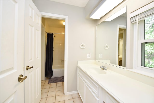 full bathroom with tile patterned flooring, baseboards, shower / bath combo, and vanity