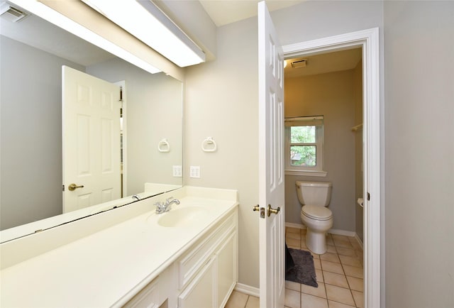 bathroom with visible vents, tile patterned floors, baseboards, vanity, and toilet