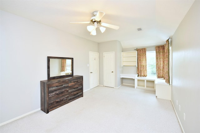 unfurnished bedroom with carpet flooring, baseboards, and visible vents