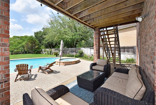 view of pool with an in ground hot tub, a patio area, a fenced in pool, a fenced backyard, and stairs