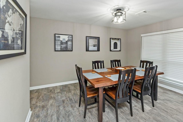 3300 Michelle Ave, Vidor, TX 77662 - dining space featuring baseboards, wood finished floors, and visible vents