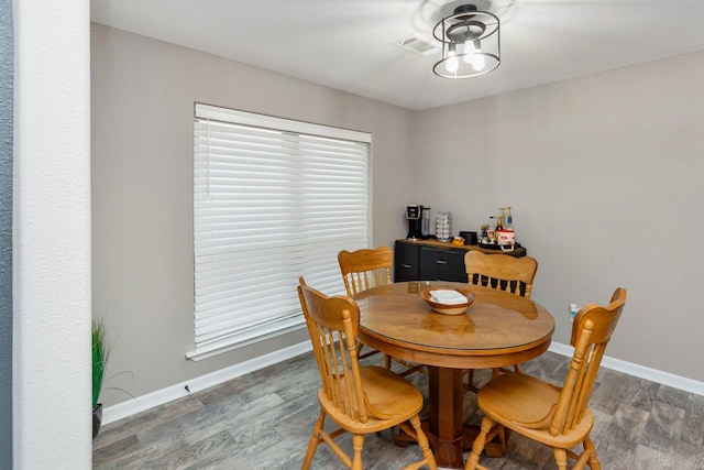 3300 Michelle Ave, Vidor, TX 77662 - dining room featuring baseboards, wood finished floors, and visible vents