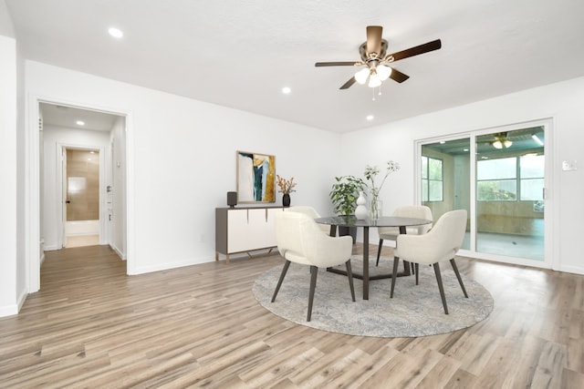 dining room with baseboards, a ceiling fan, recessed lighting, and light wood-style flooring