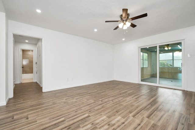 unfurnished room featuring a ceiling fan, recessed lighting, and wood finished floors