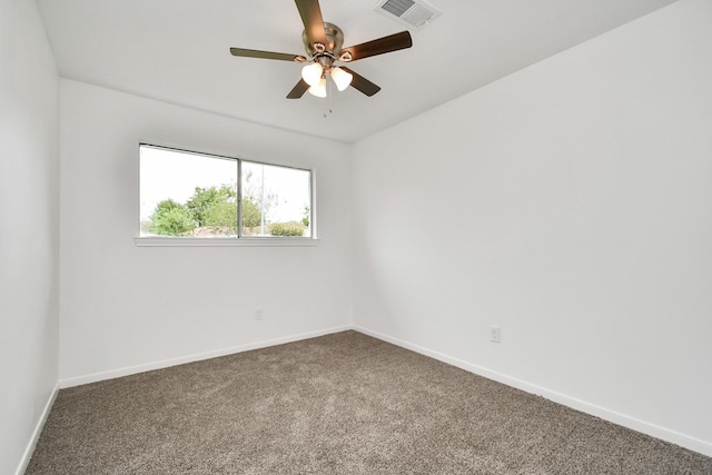 spare room with visible vents, baseboards, carpet floors, and ceiling fan