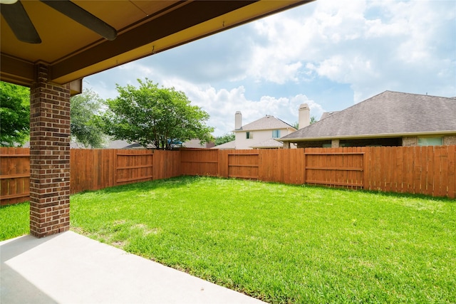 view of yard featuring a patio and a fenced backyard
