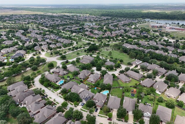 bird's eye view featuring a water view and a residential view