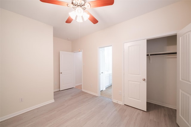unfurnished bedroom featuring a closet, a ceiling fan, light wood-style flooring, and baseboards