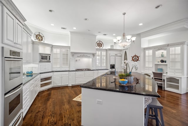 kitchen with ornamental molding, dark wood-style floors, a sink, a warming drawer, and stainless steel appliances