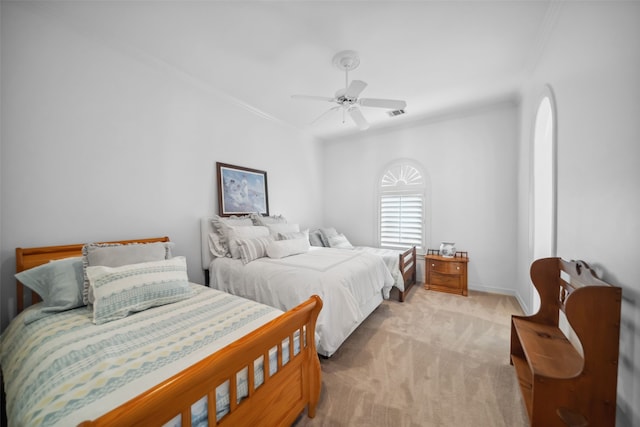 bedroom featuring ceiling fan, light colored carpet, ornamental molding, and baseboards