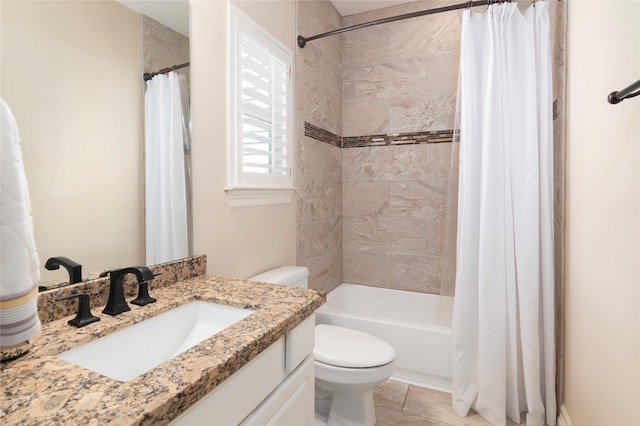 full bathroom with vanity, shower / bath combo, and toilet