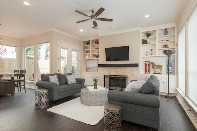 1900 Vermont St Unit B, Houston, TX 77019 - living room with ceiling fan, dark wood-style floors, a stone fireplace, crown molding, and built in features
