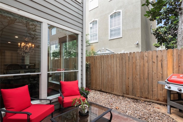view of patio with fence and grilling area
