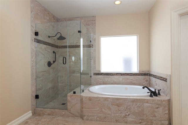full bathroom featuring recessed lighting, a bath, and a shower stall