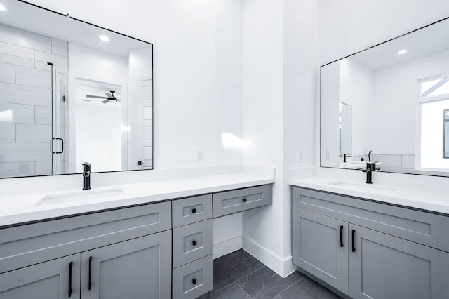 1707 Milby St, Houston, TX 77003 - bathroom featuring a sink, tile patterned flooring, a shower stall, and two vanities