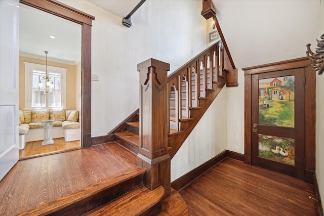 2614 Stanford St, Houston, TX 77006 - stairway with wood finished floors, baseboards, and crown molding