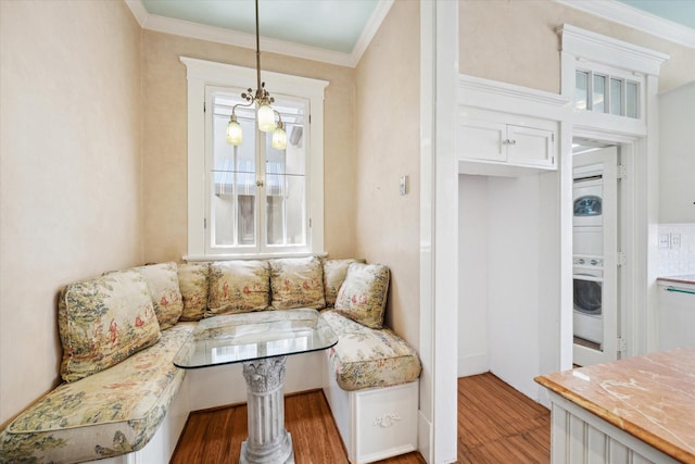 2614 Stanford St, Houston, TX 77006 - sitting room featuring washer / dryer, wood finished floors, and ornamental molding