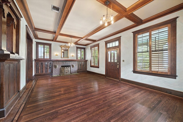 2614 Stanford St, Houston, TX 77006 - unfurnished living room featuring a chandelier, dark wood-style floors, coffered ceiling, a brick fireplace, and beamed ceiling