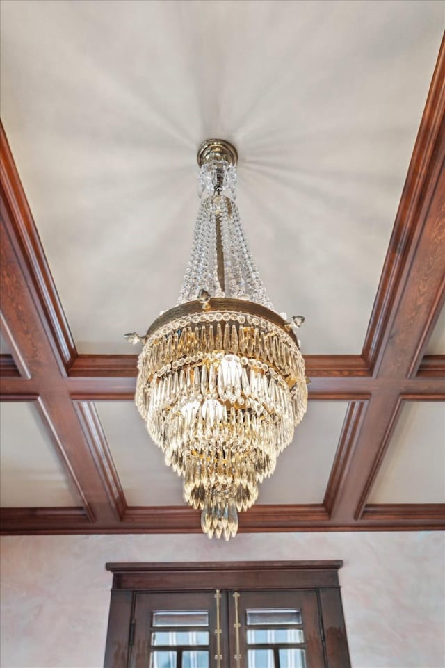 2614 Stanford St, Houston, TX 77006 - detailed view of a chandelier, ornamental molding, coffered ceiling, and beam ceiling