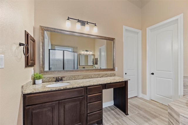 15306 Guava Vis, Conroe, TX 77302 - full bathroom with vanity, an enclosed shower, and baseboards