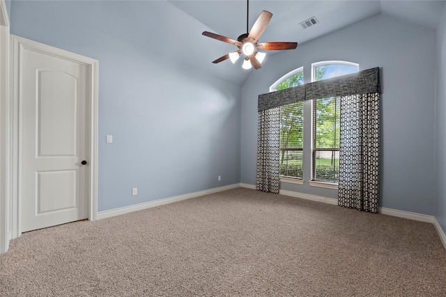 15306 Guava Vis, Conroe, TX 77302 - carpeted spare room with lofted ceiling, healthy amount of natural light, ceiling fan, and baseboards