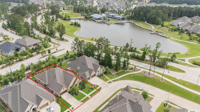 15306 Guava Vis, Conroe, TX 77302 - aerial perspective of suburban area featuring a large body of water and property parcel outlined