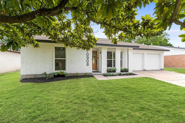 10908 Braewick Dr, Houston, TX 77096 - view of front of house with brick siding, driveway, an attached garage, and a front yard