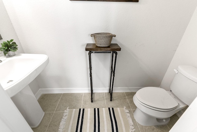 2502 Crossvine Dr, Katy, TX 77494 - half bath with toilet, baseboards, and tile patterned flooring