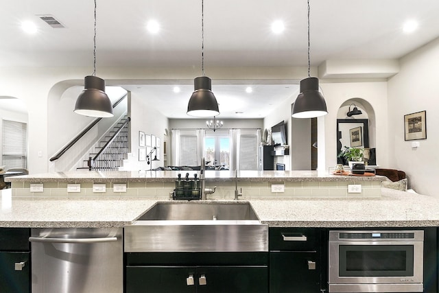 2502 Crossvine Dr, Katy, TX 77494 - kitchen featuring visible vents, dark cabinetry, open floor plan, and dishwasher