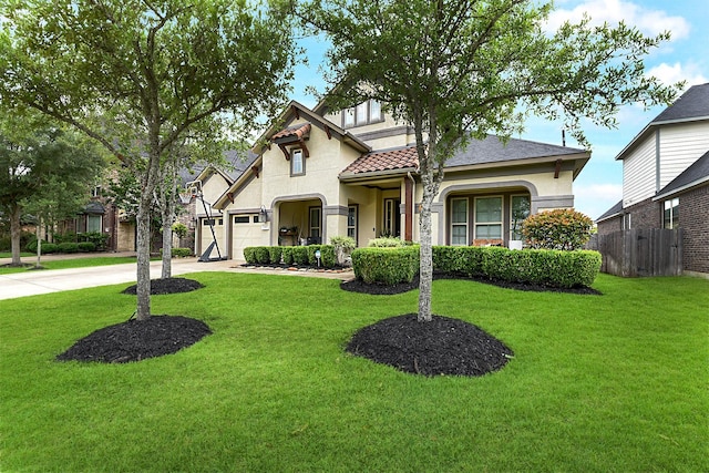 2502 Crossvine Dr, Katy, TX 77494 - view of front facade with fence, stucco siding, driveway, and a front yard