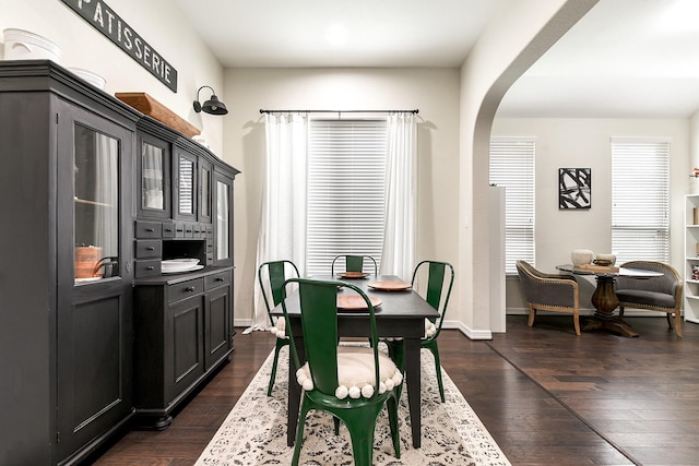 2502 Crossvine Dr, Katy, TX 77494 - dining area featuring dark wood-type flooring, arched walkways, baseboards, and recessed lighting