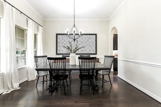2502 Crossvine Dr, Katy, TX 77494 - dining room with crown molding, arched walkways, dark wood-style floors, and a chandelier