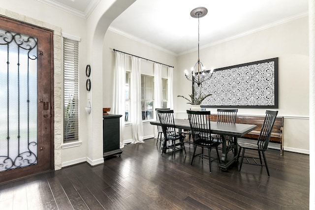 2502 Crossvine Dr, Katy, TX 77494 - dining area featuring arched walkways, wood finished floors, baseboards, a notable chandelier, and ornamental molding