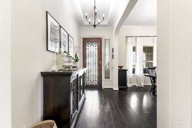 2502 Crossvine Dr, Katy, TX 77494 - entrance foyer featuring a textured wall, arched walkways, a chandelier, ornamental molding, and dark wood-style floors