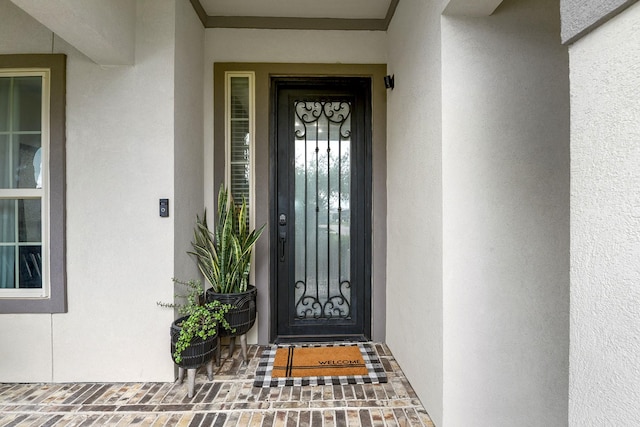 2502 Crossvine Dr, Katy, TX 77494 - doorway to property featuring stucco siding