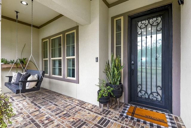 2502 Crossvine Dr, Katy, TX 77494 - view of exterior entry with covered porch and stucco siding