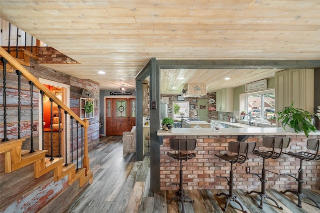 bar with recessed lighting, wooden ceiling, wood finished floors, and stairway
