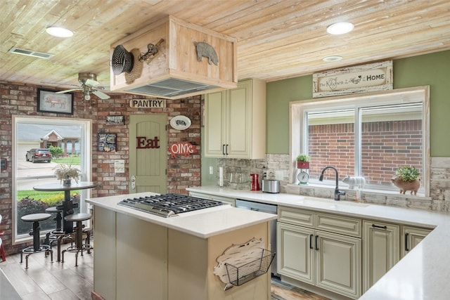 kitchen with gas cooktop, wood ceiling, ceiling fan, and visible vents