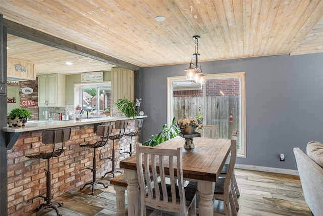 dining area featuring recessed lighting, wood ceiling, baseboards, and light wood-type flooring