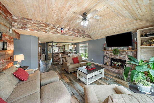 living area featuring a ceiling fan, vaulted ceiling, wooden ceiling, baseboards, and wood-type flooring