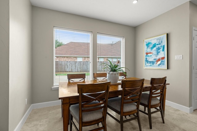 dining area featuring plenty of natural light and baseboards