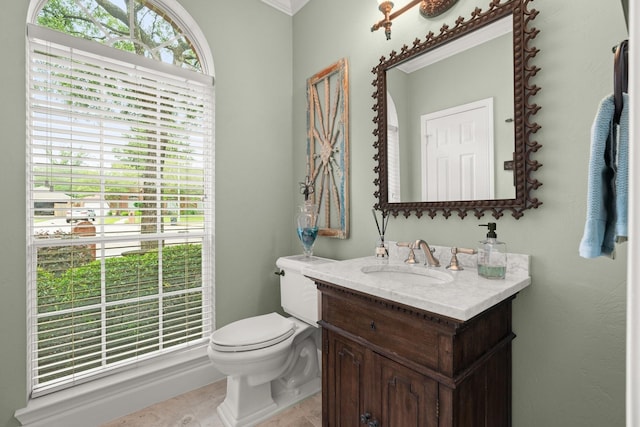 half bathroom featuring vanity and toilet